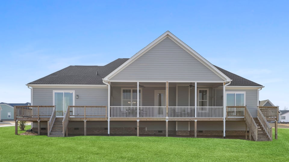 Back exterior with large backyard.