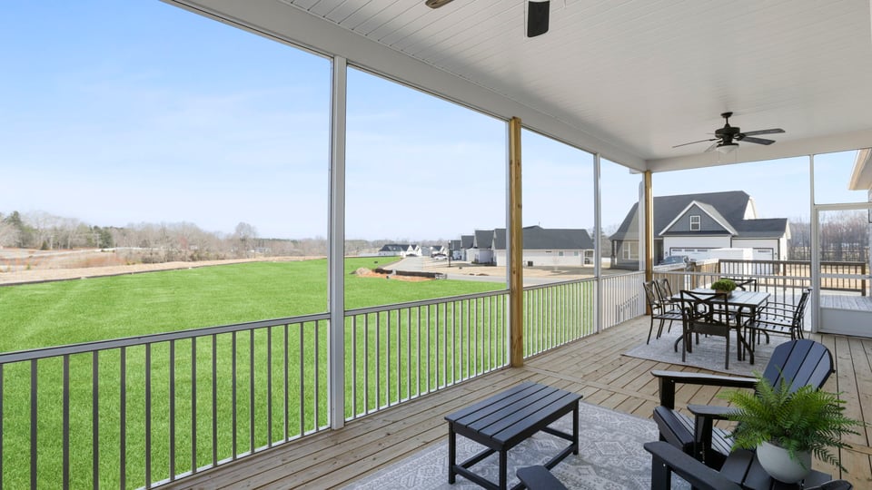 Back covered patio with large backyard.