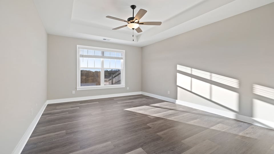 Primary bedroom with windows.
