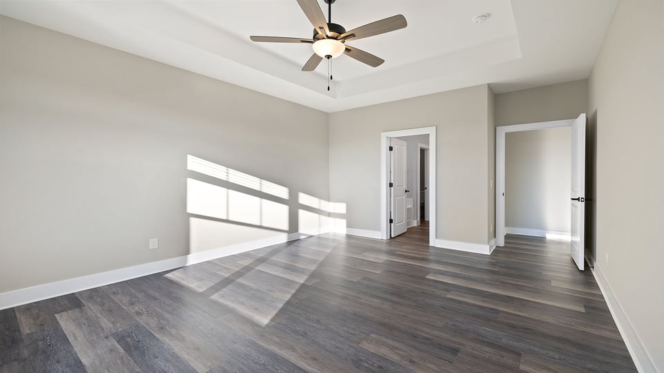 Primary bedroom with windows.