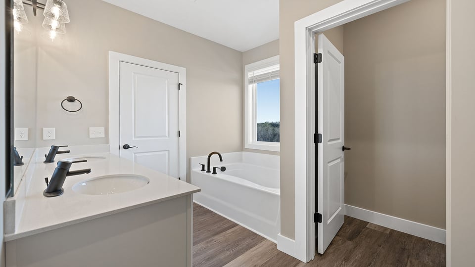 Primary bathroom with double vanity sinks.
