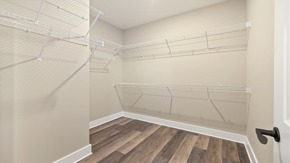 Primary closet with shelf.