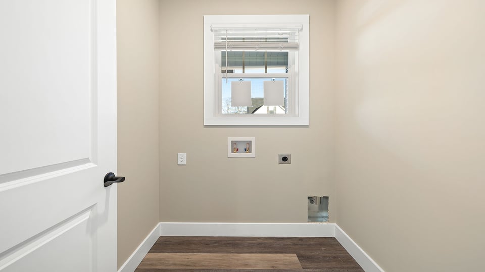 Laundry room with shelf.