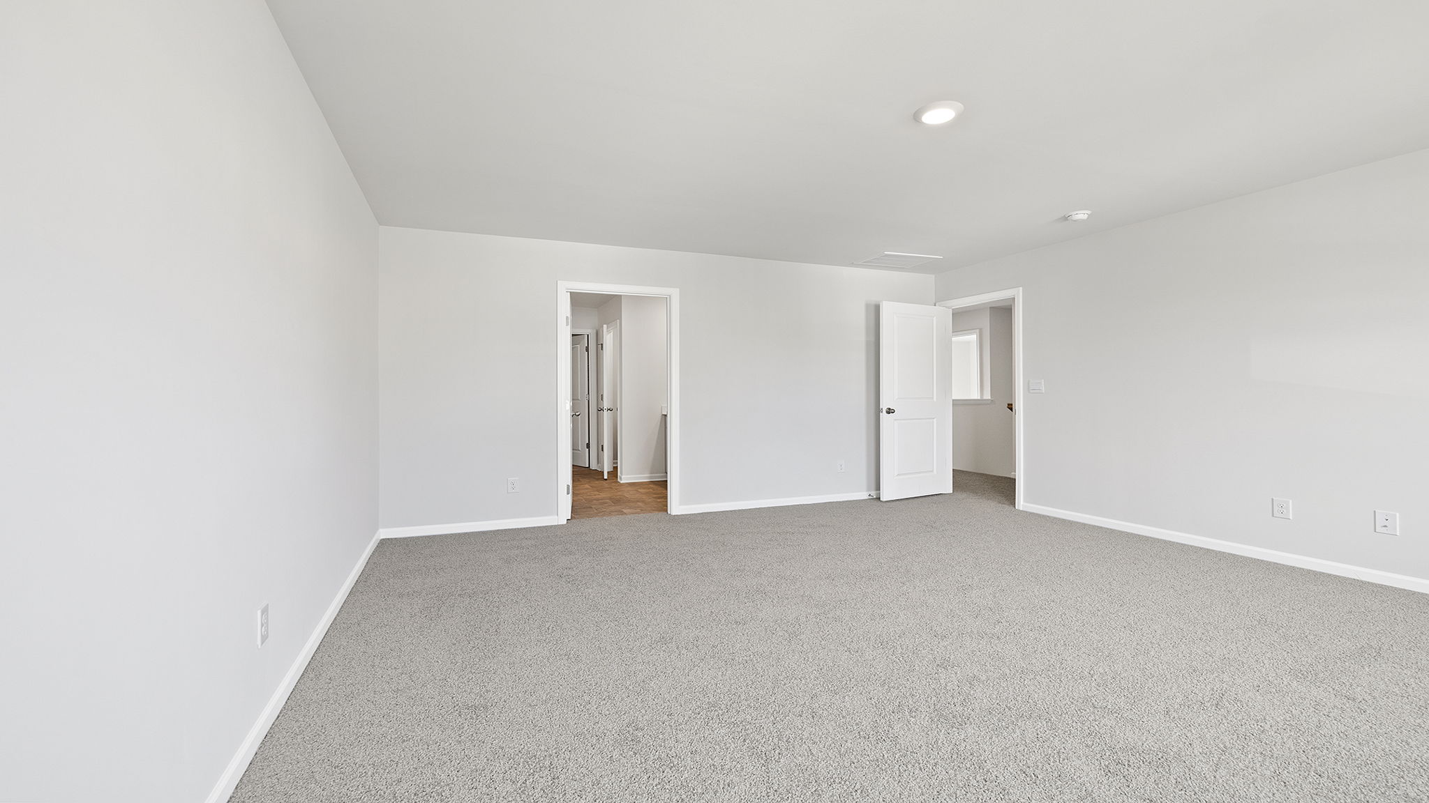 Bedroom with carpet and window.