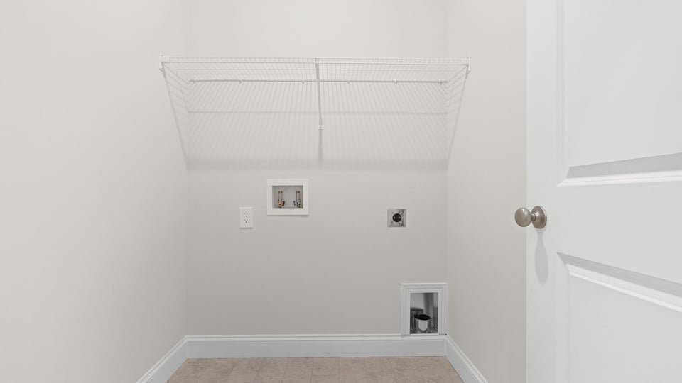 Walk in laundry with shelves.