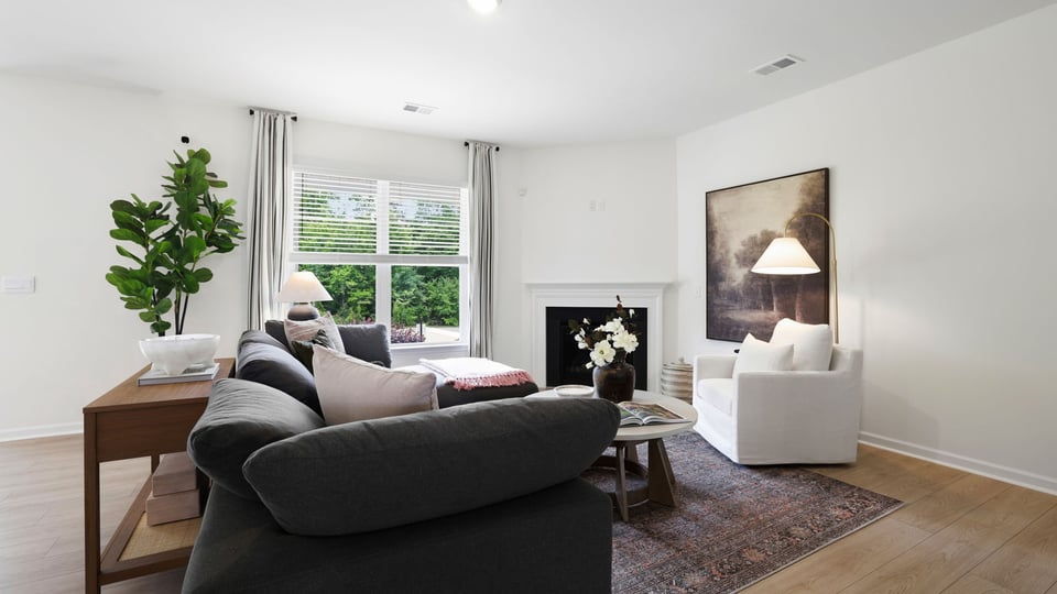Livingroom with fireplace and window.