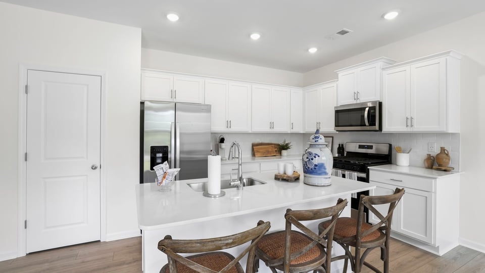 Kitchen with island and countertops.