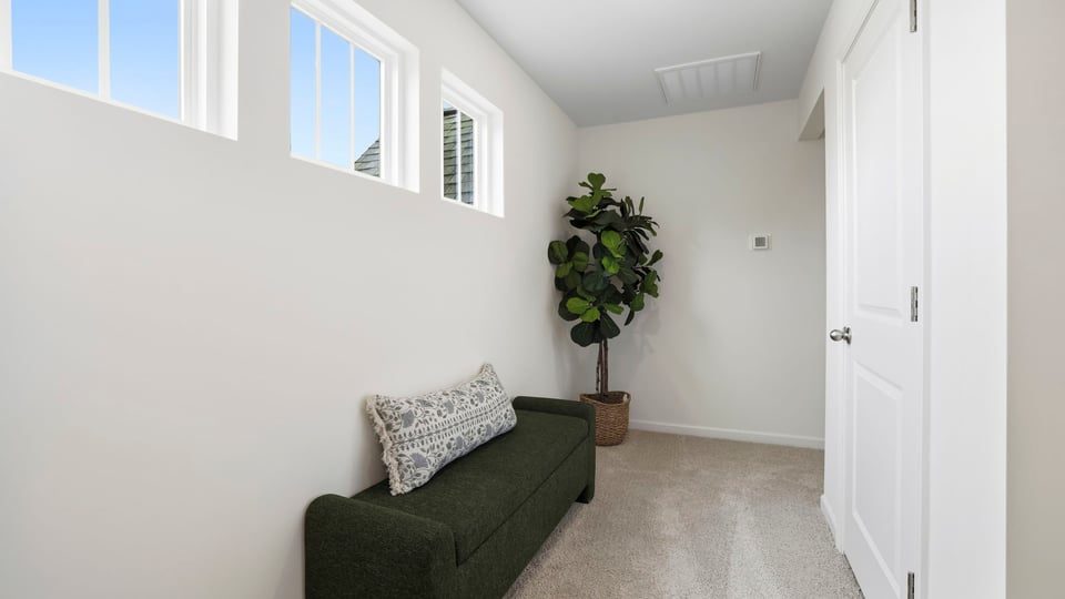 Hallway with carpet.
