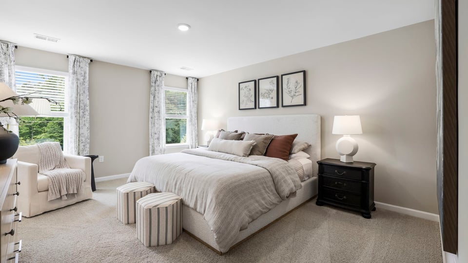 Bedroom with carpet and window.