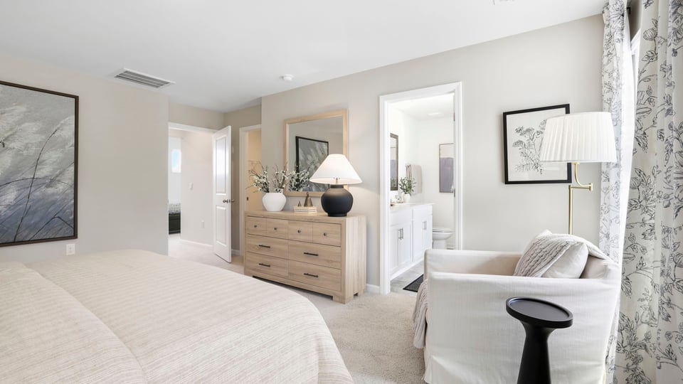 Bedroom with carpet and window.