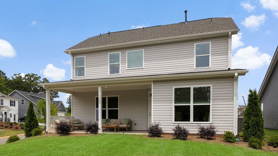 Exterior of home with large backyard.