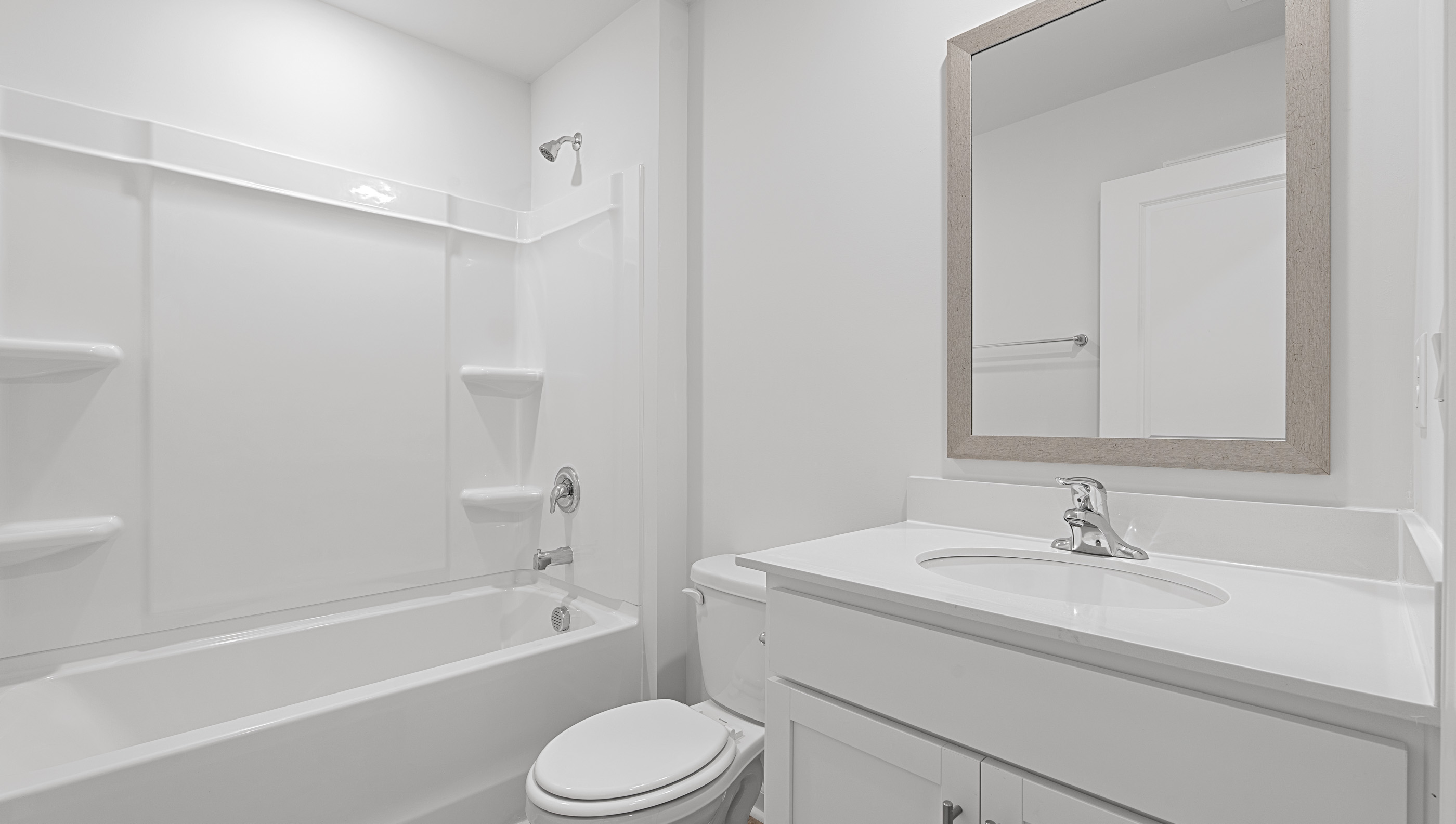 Bathroom with vanity and tub.
