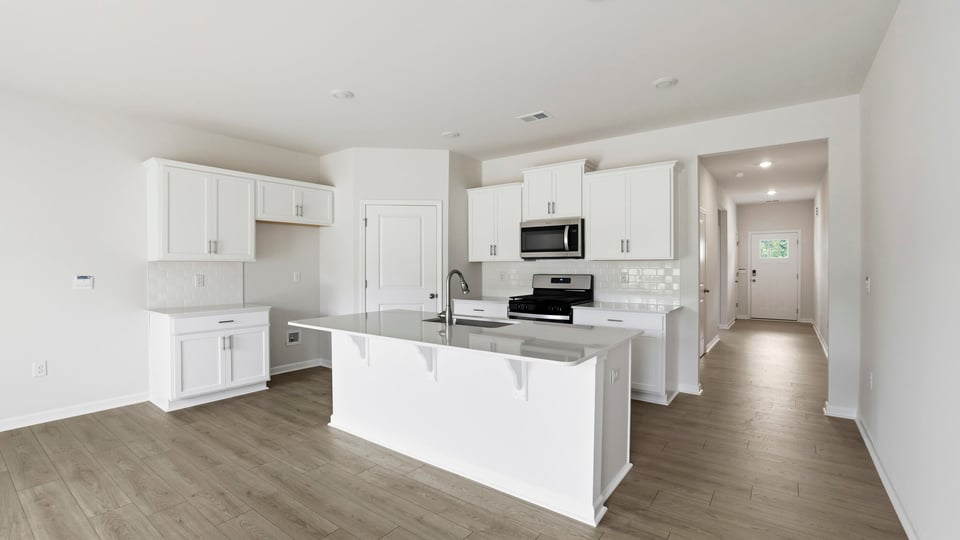 Full view of kitchen and entry hallway