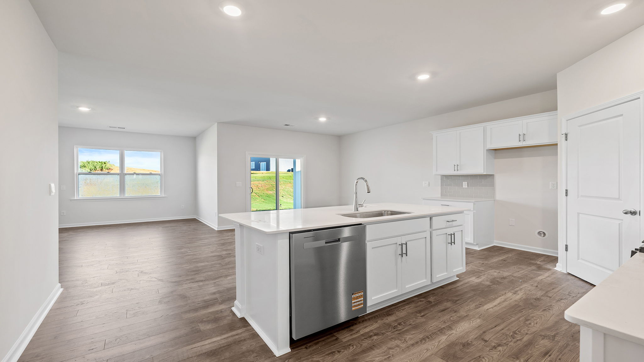 Kitchen and island with granite countertops.