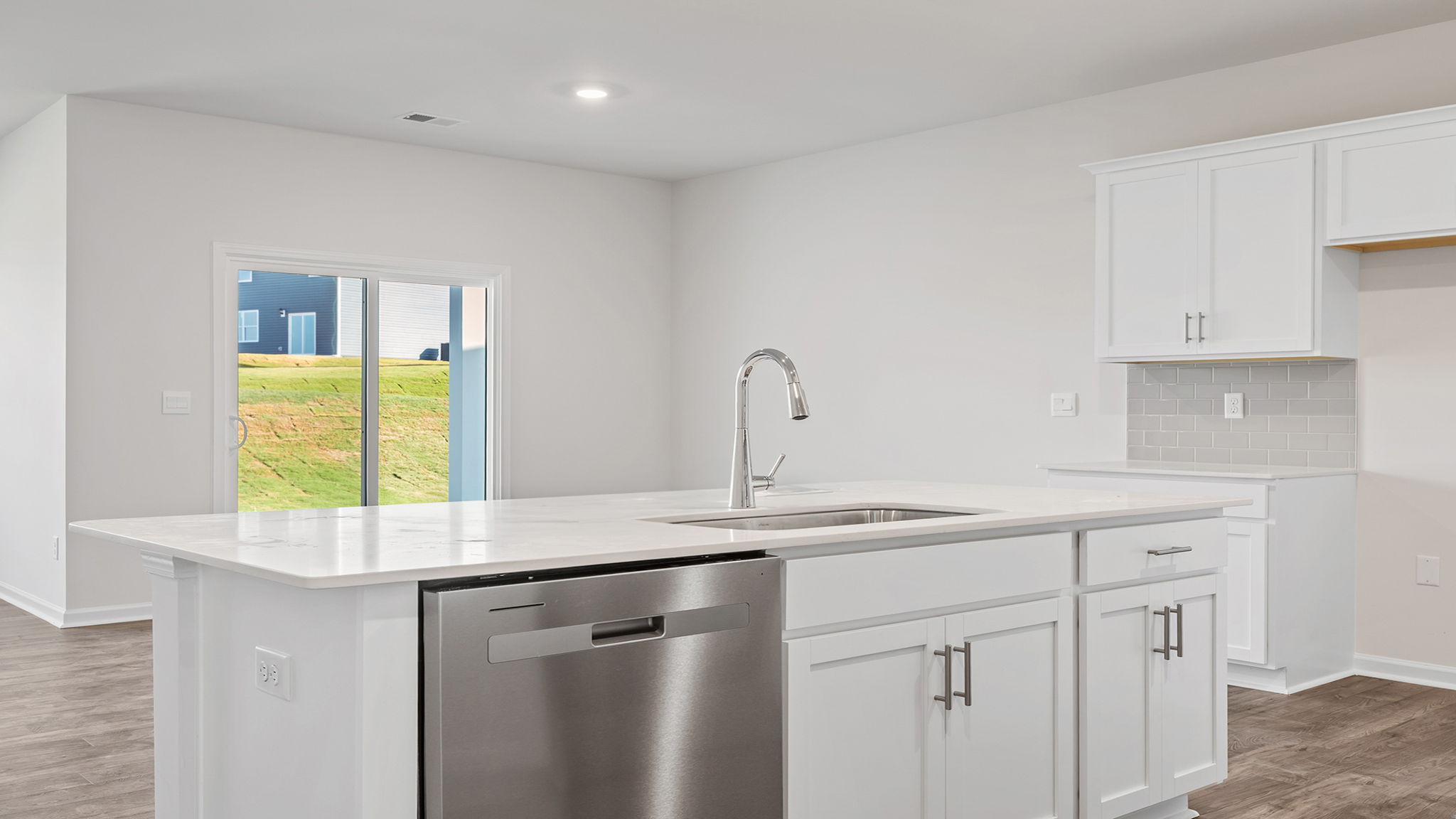 Kitchen and island with granite countertops.