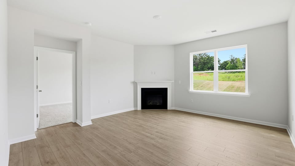 Living room with fireplace and window