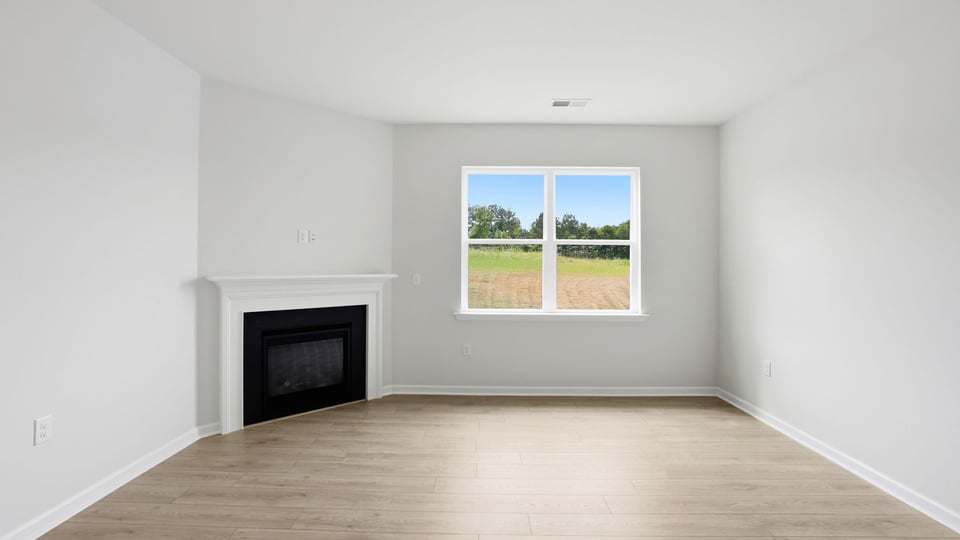 Living room with fireplace and window