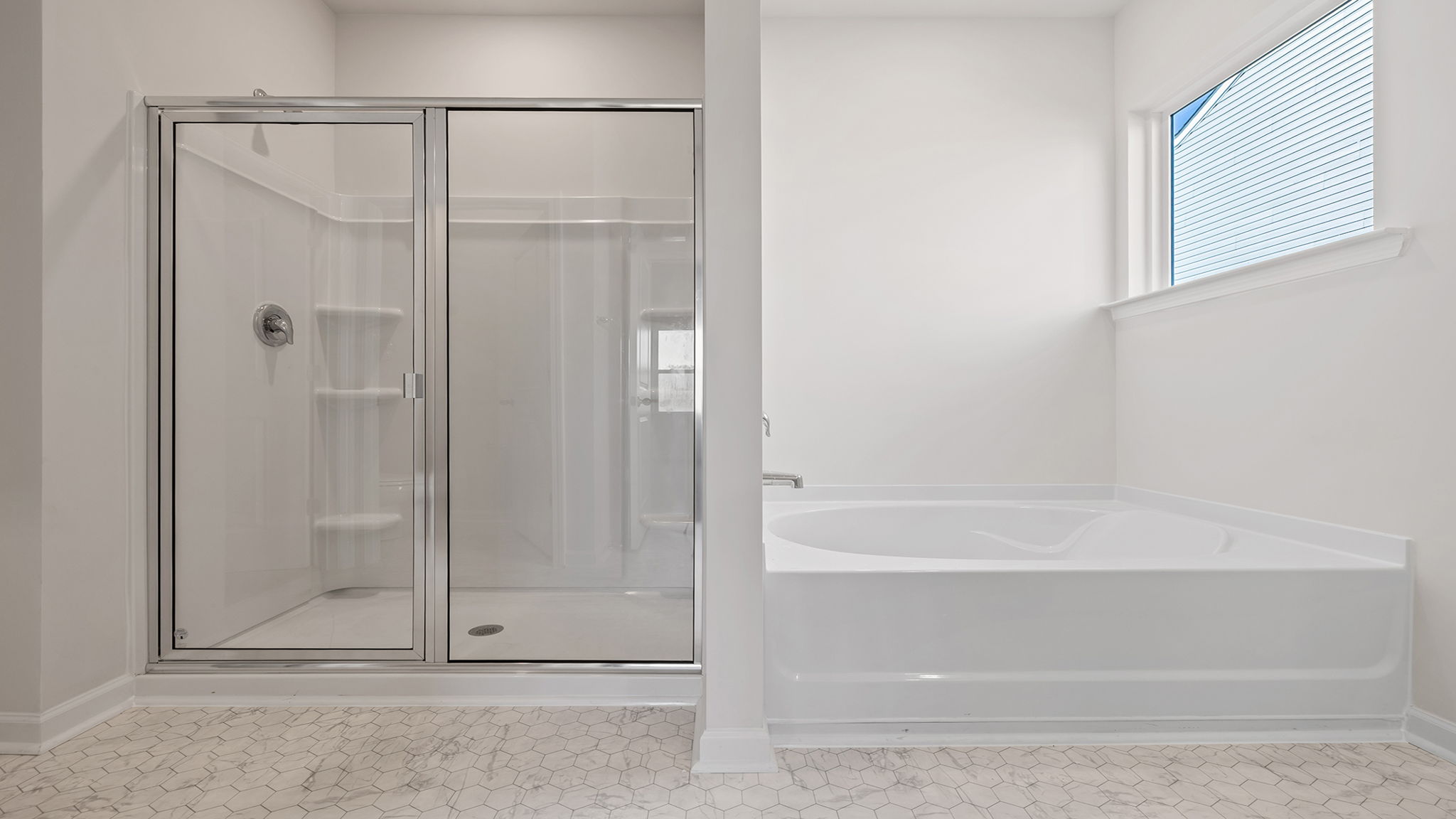 Bathroom with tub and walk in shower.