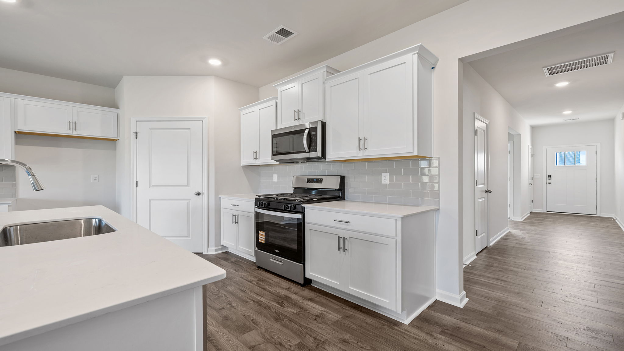 Kitchen and island with granite countertops.