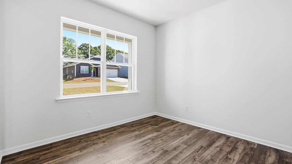 Formal dining room with window.