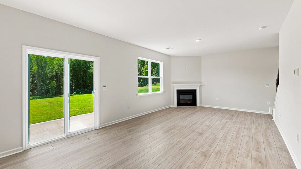 Living area with windows and fireplace.