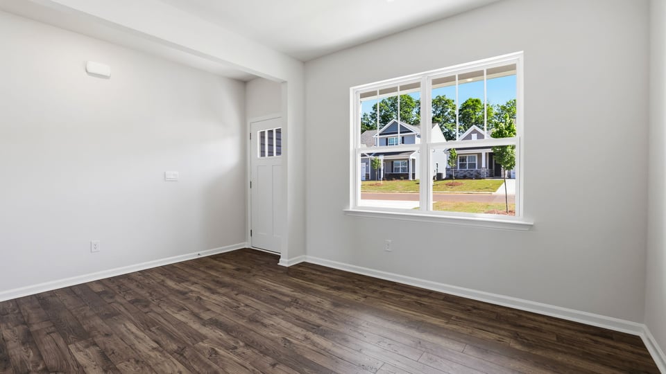 Formal dining room with window.