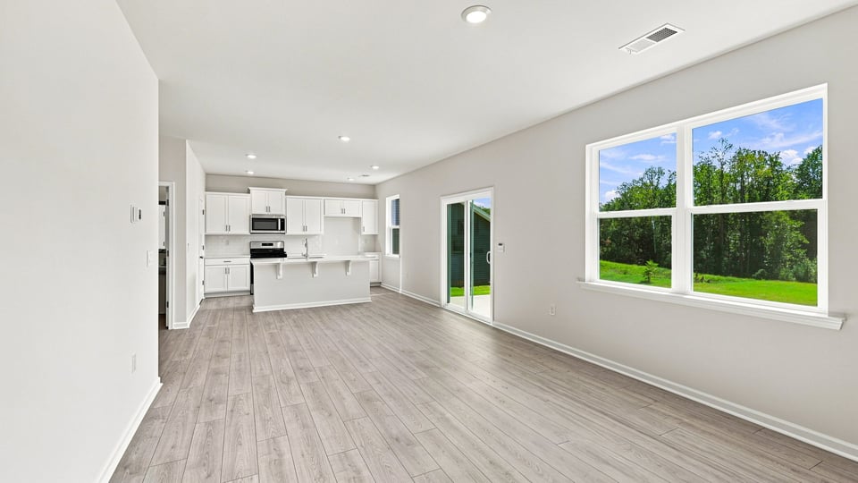 Living area with windows and fireplace.