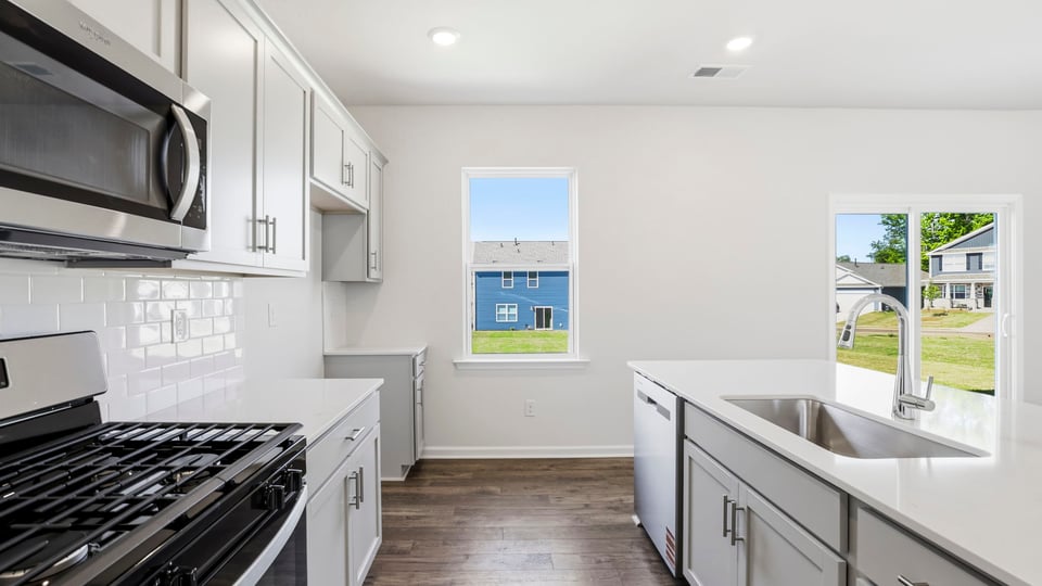 Kitchen with island and countertops.