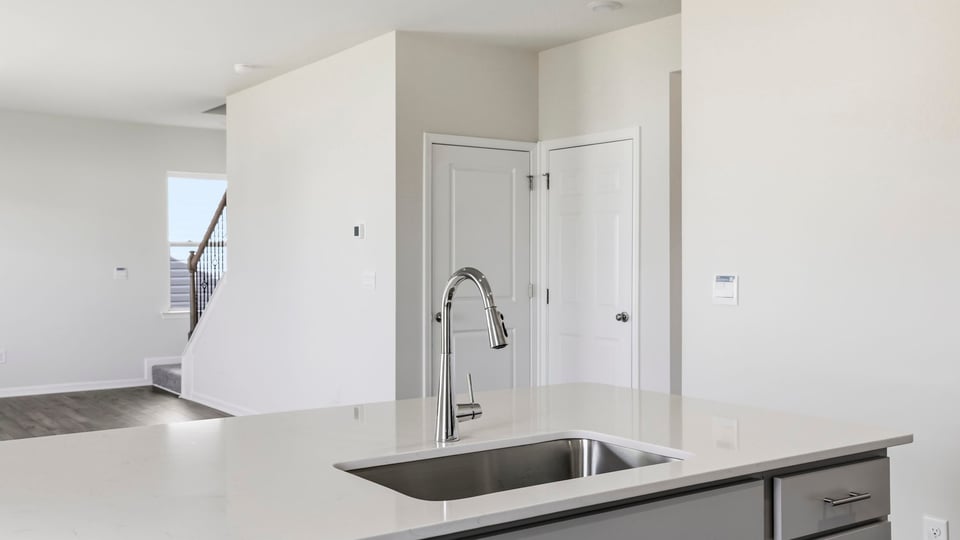 Kitchen with island and countertops.