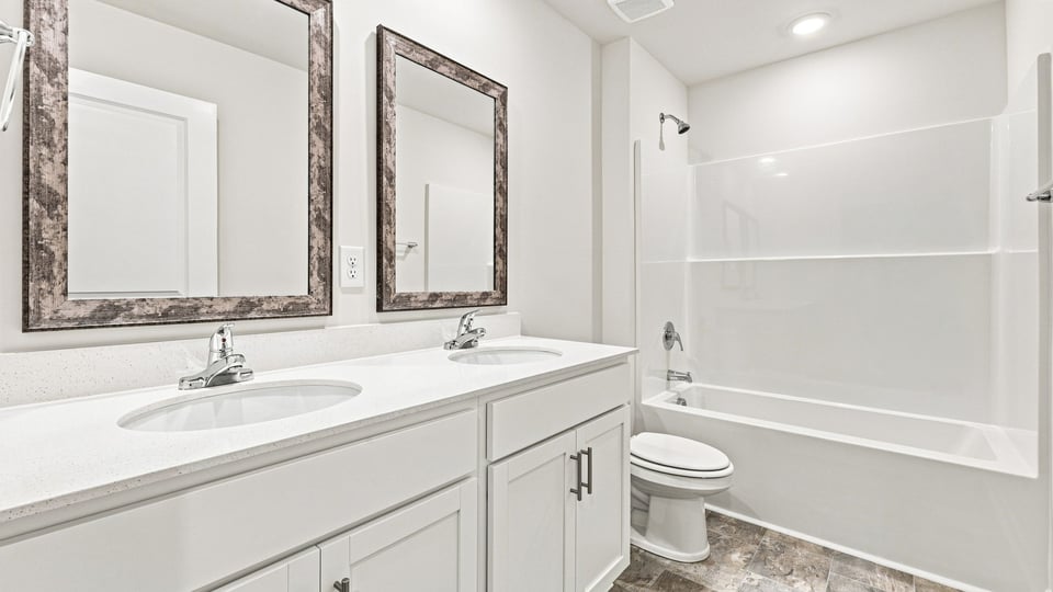 Bathroom with double vanity sinks.