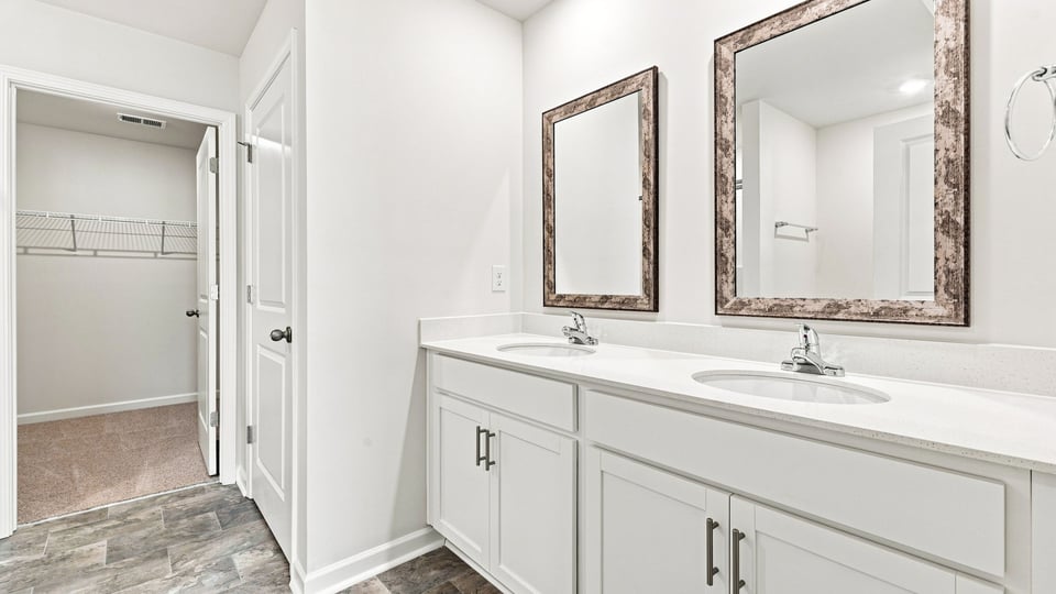 Primary bathroom with double vanity sink.
