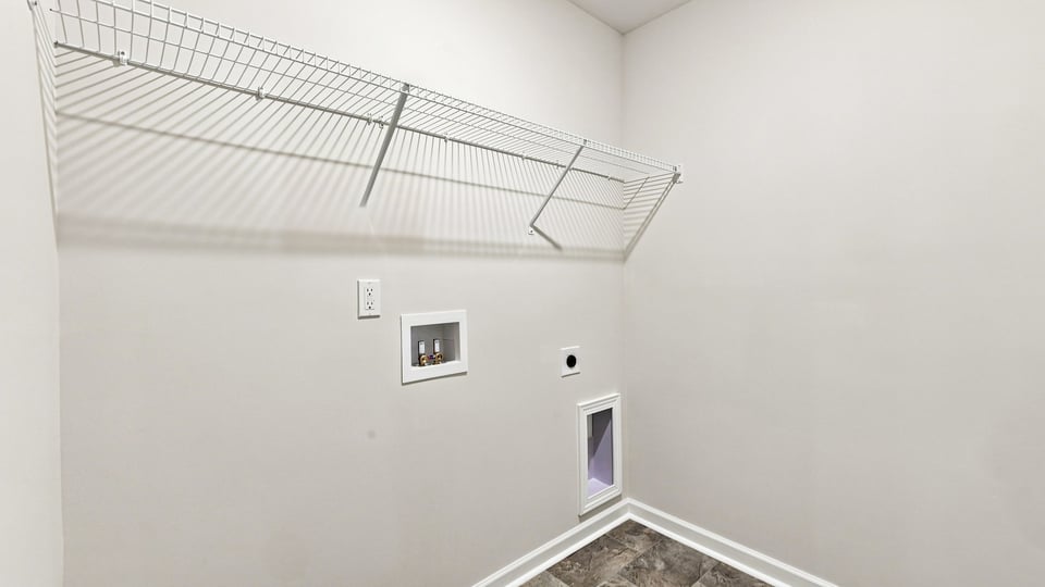 Laundry room with shelf.