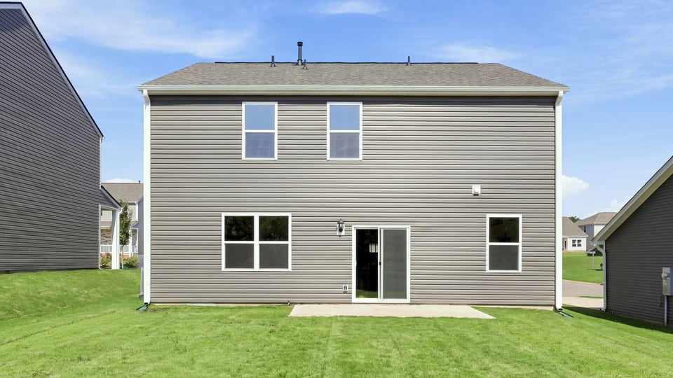 Back exterior with large backyard.