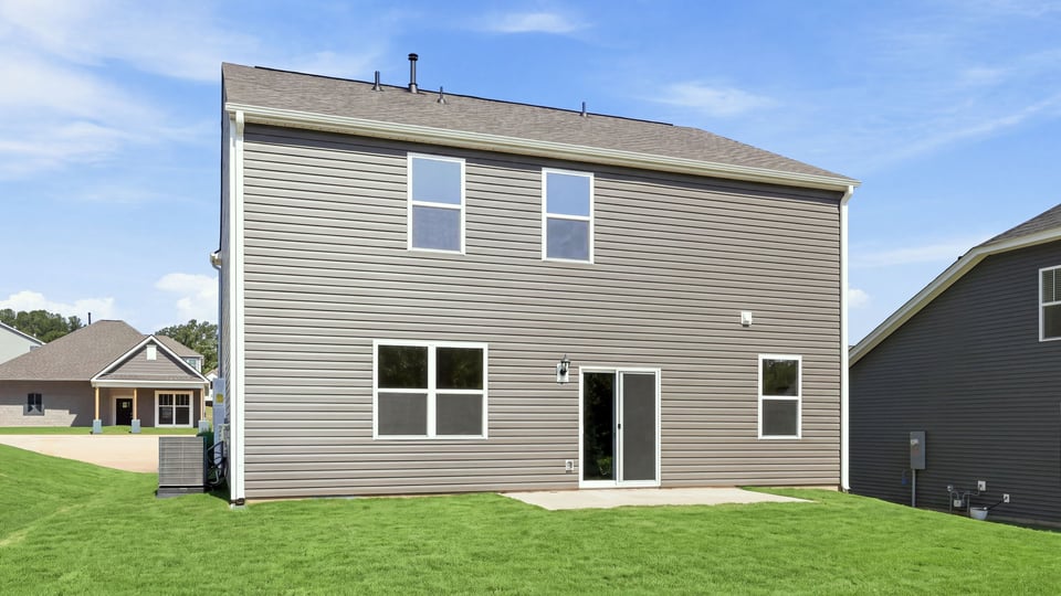 Back exterior with large backyard.
