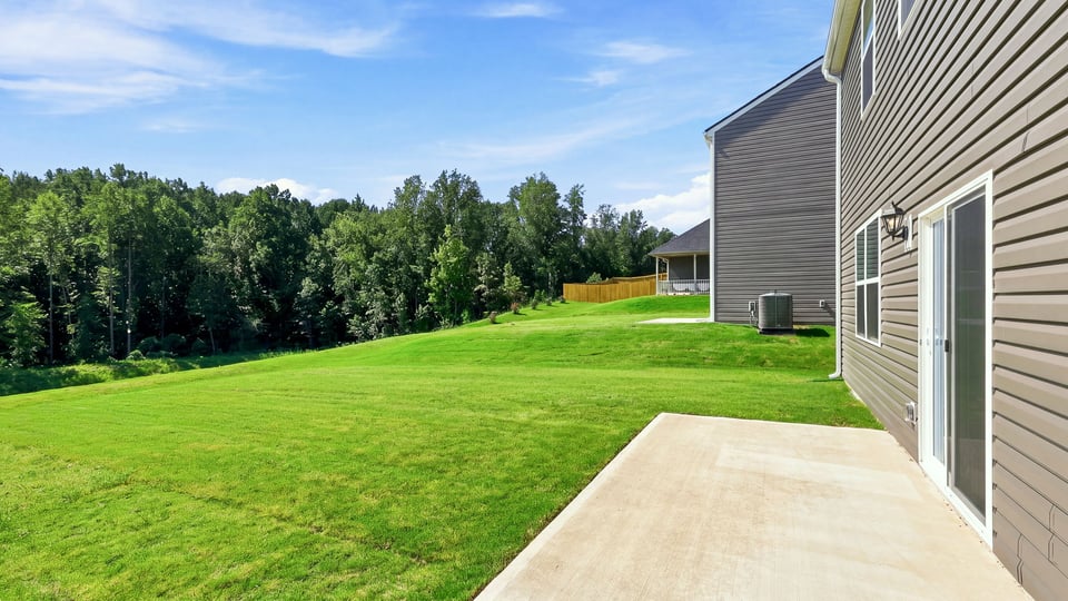 Back exterior with large backyard.
