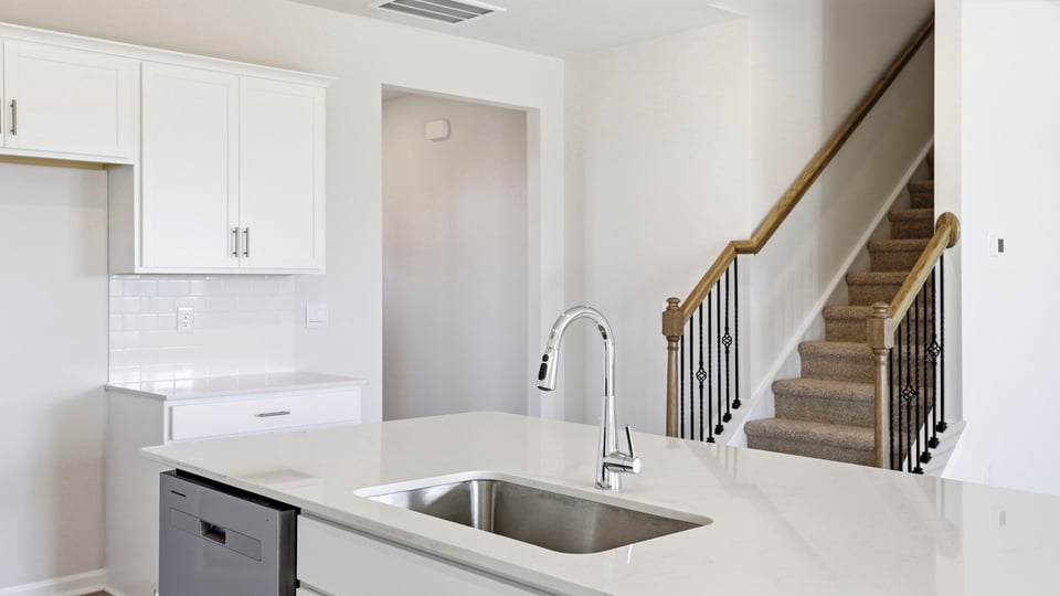 Kitchen with large island and countertops.