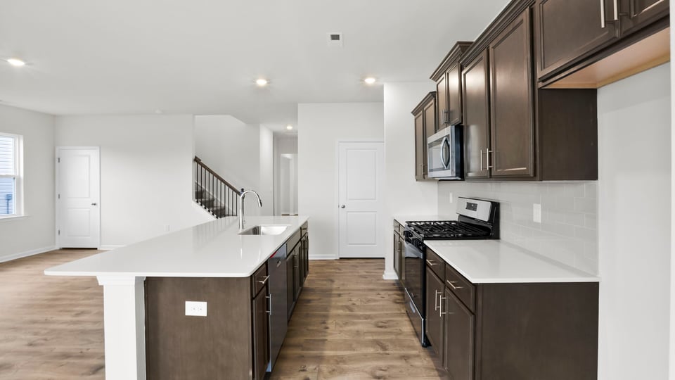 Kitchen with island and countertops.