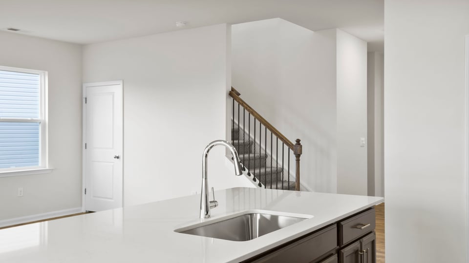 Kitchen with island and countertops.