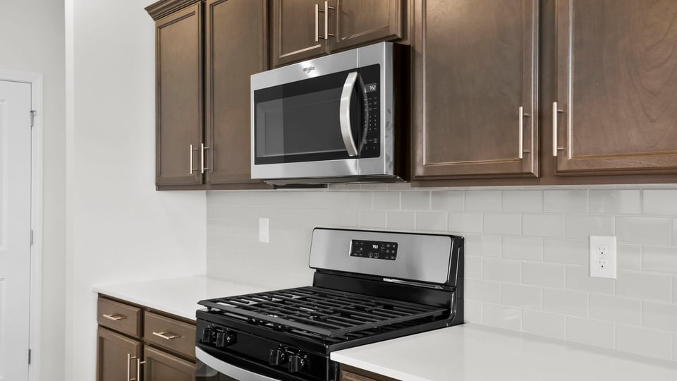 Kitchen with island and countertops.