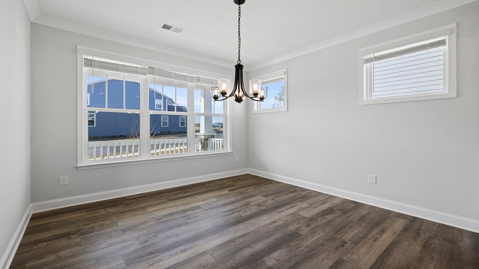 Dining room with lighting and windows.