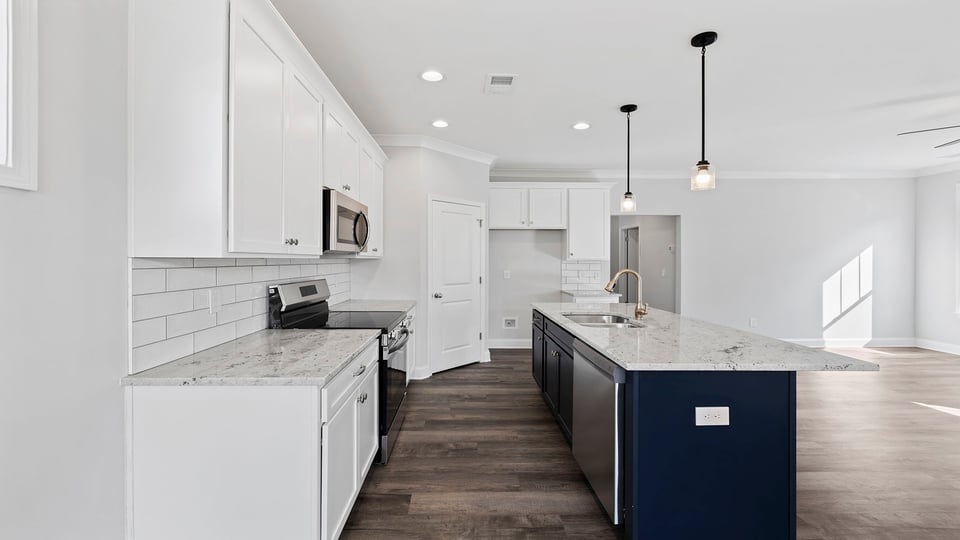 Kitchen and island with granite countertops.