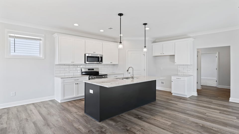 Kitchen and island with granite countertops.