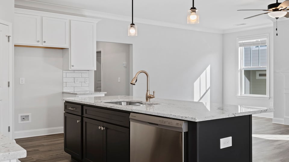 Kitchen and island with granite countertops.