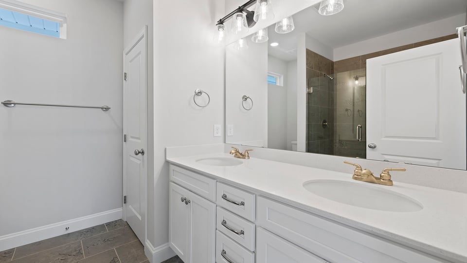 Bathroom with dual vanity.