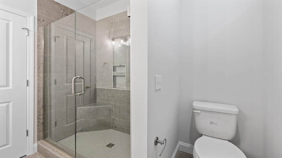 Bathroom with walk in shower.