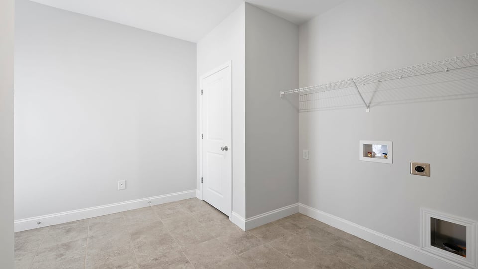 Walk in laundry with shelves.