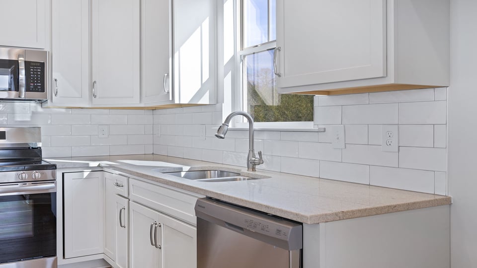 Kitchen with granite countertops and stainless steel appliances.