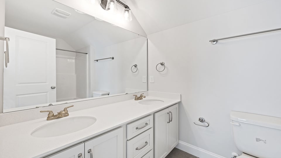 Bathroom with dual vanity.
