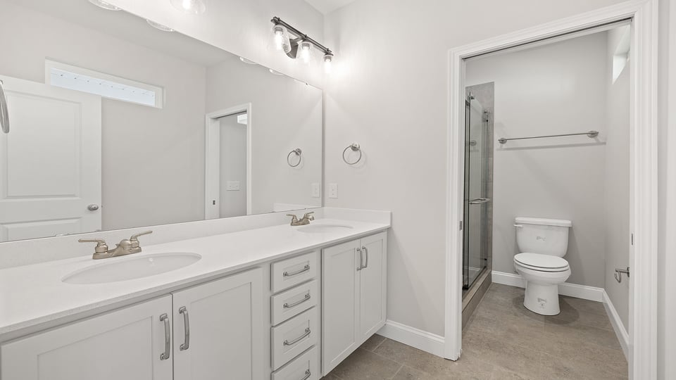 Bathroom with dual vanity.