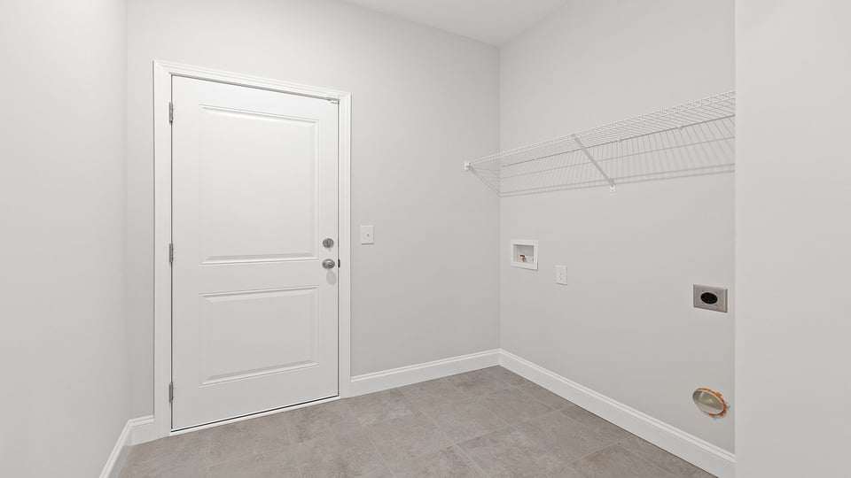 Walk in laundry with shelves.